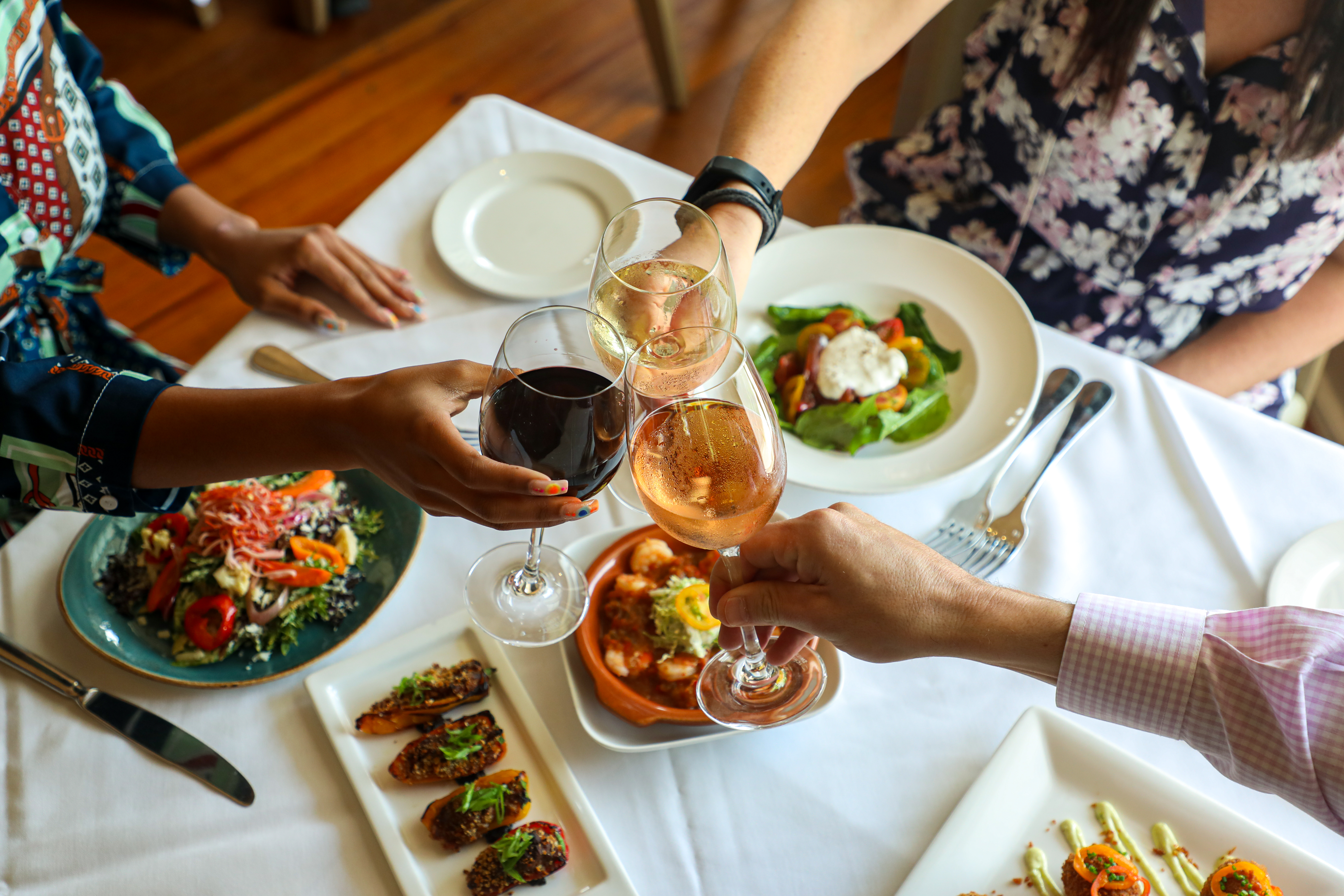 3 Appetizers and a Glass of Wine $35 Promo Image